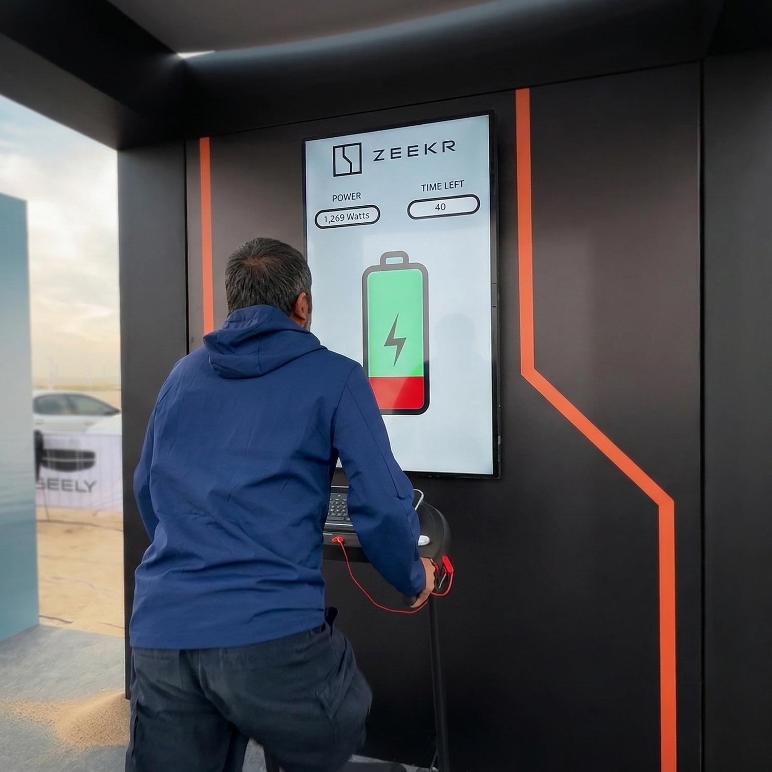 Interactive Treadmill Activation in Dubai: Participants generating human power to recharge EV cars